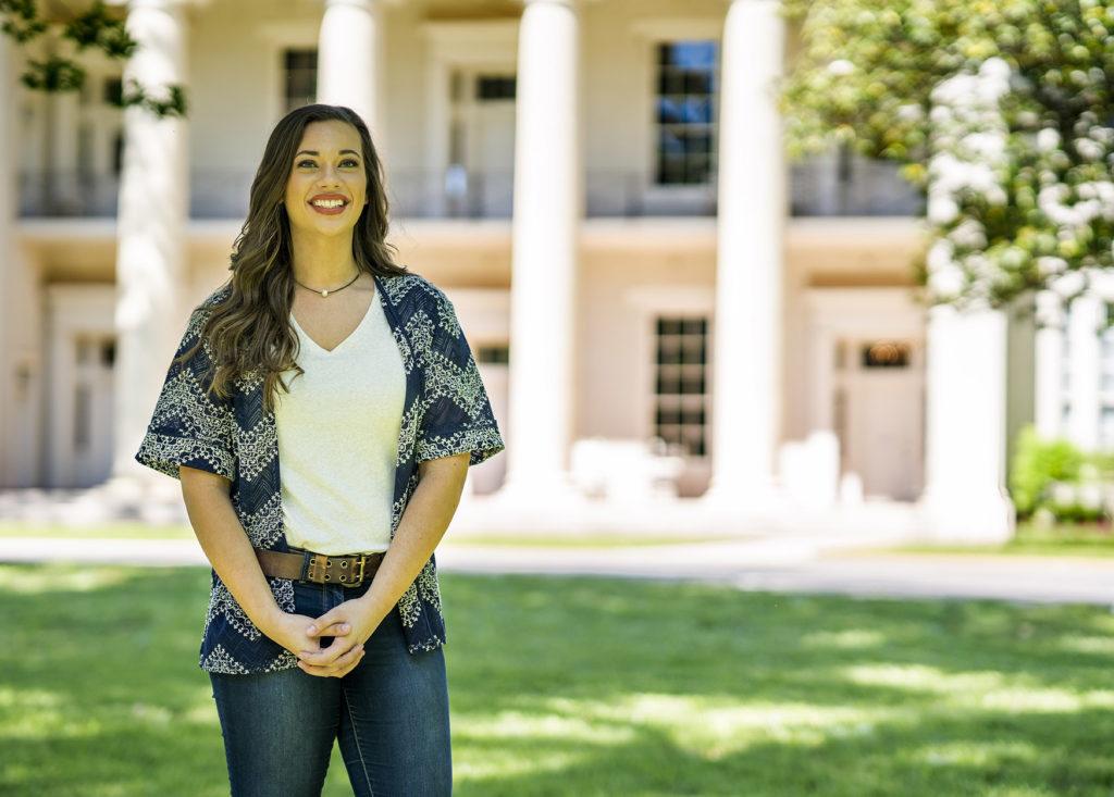 Student in front of Founders Hall